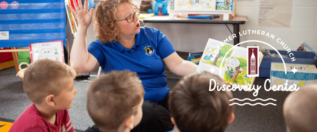 teacher reading book to preschoolers