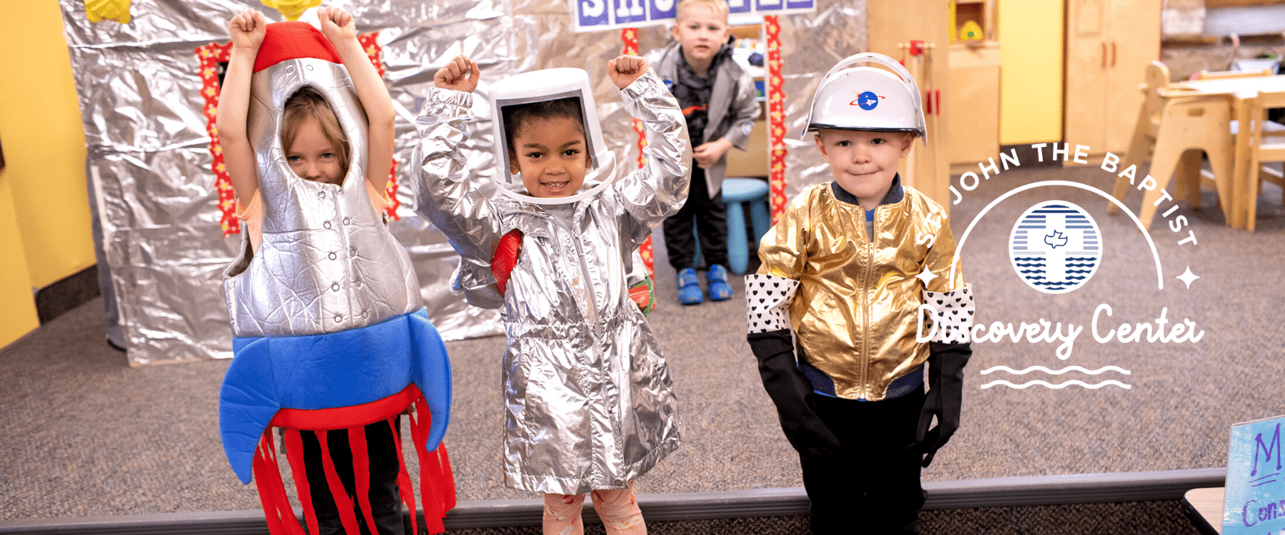 three preschoolers dressed in costume