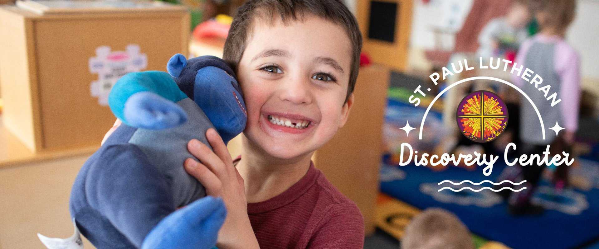 preschool boy with stuffed monkey